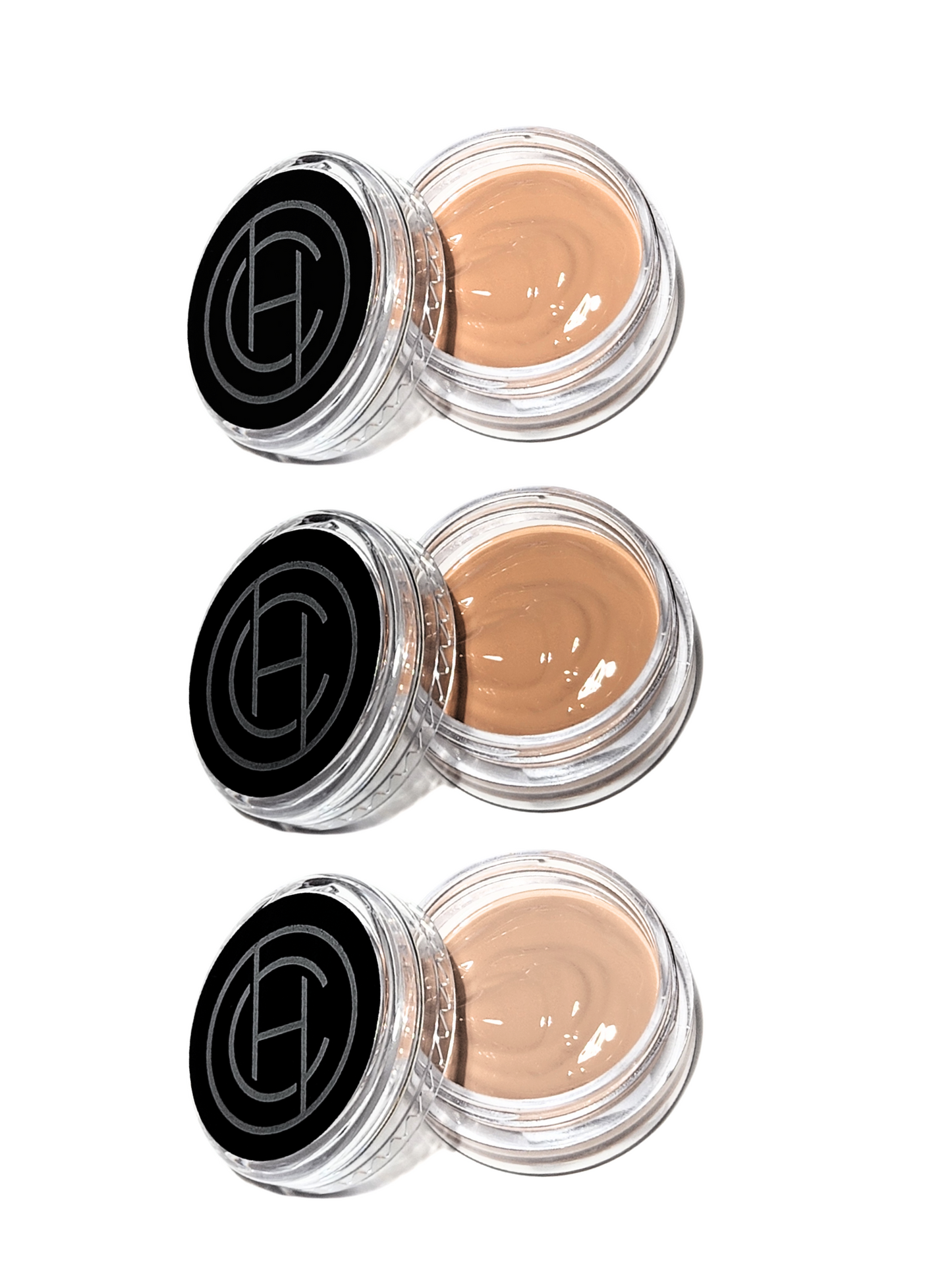 Three small jars of Chantal Hart BB cream, each with a different shade, arranged vertically.
