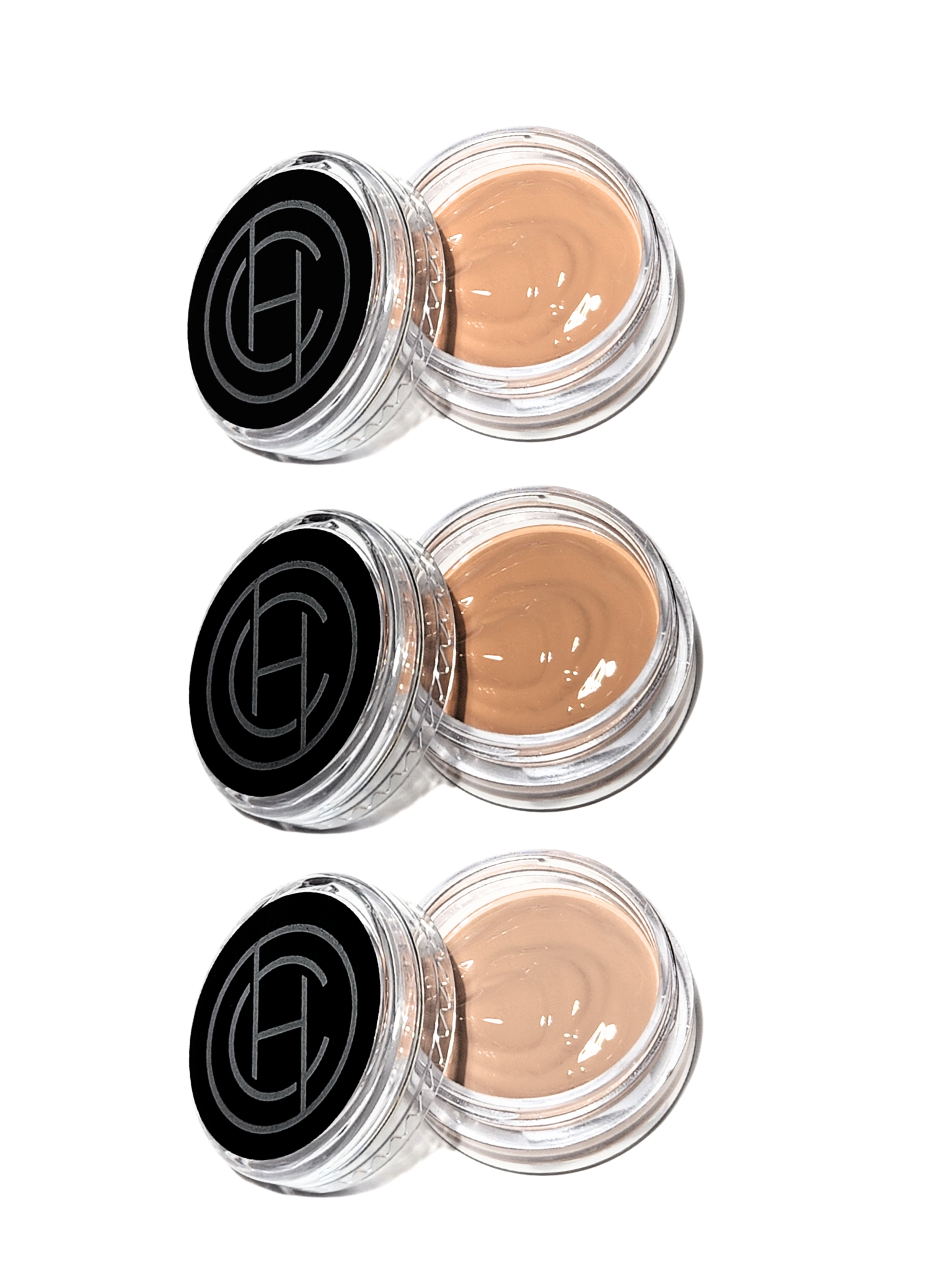 Three small jars of Chantal Hart BB cream, each with a different shade, arranged vertically.