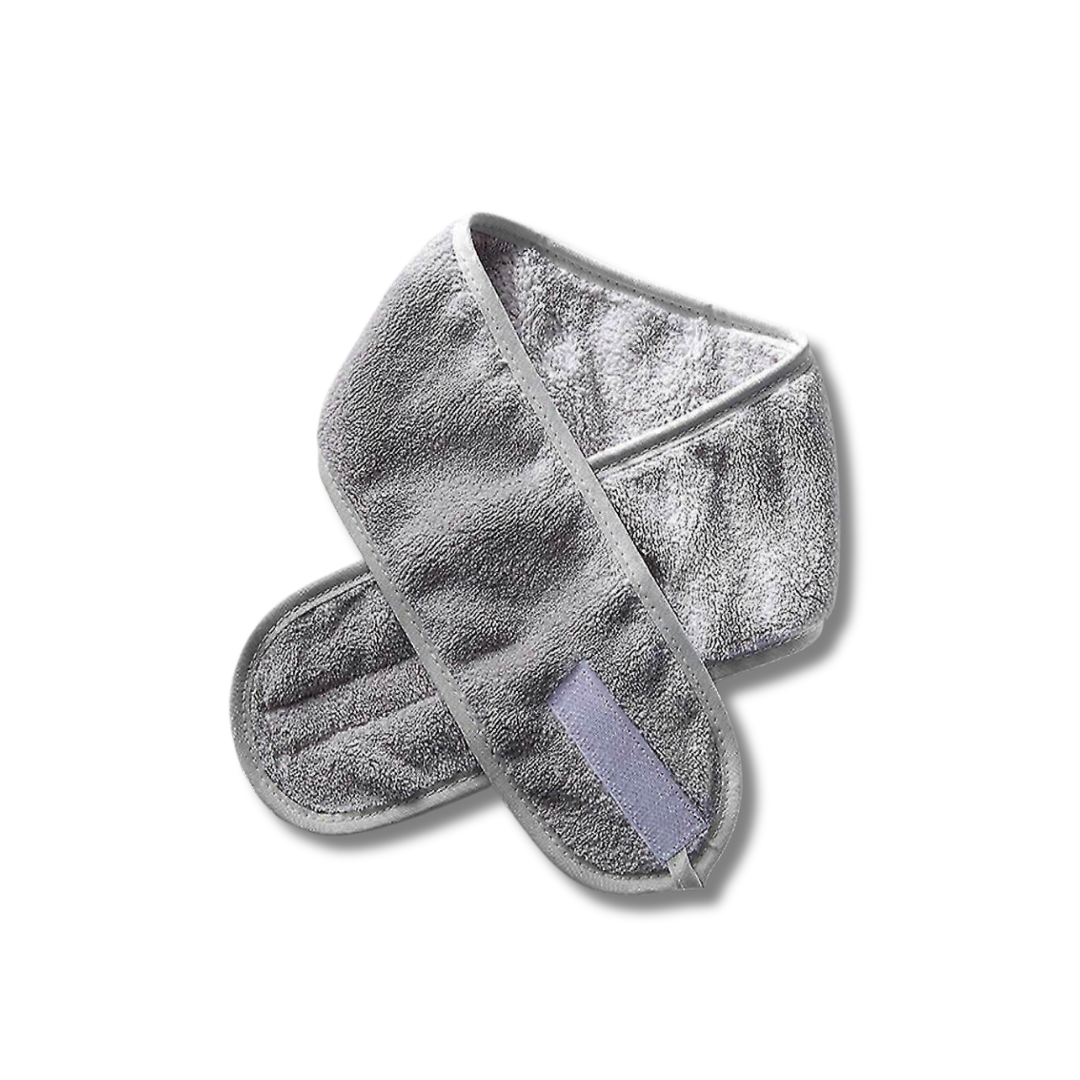 A grey headwrap used for holding hair out of the face when applying makeup