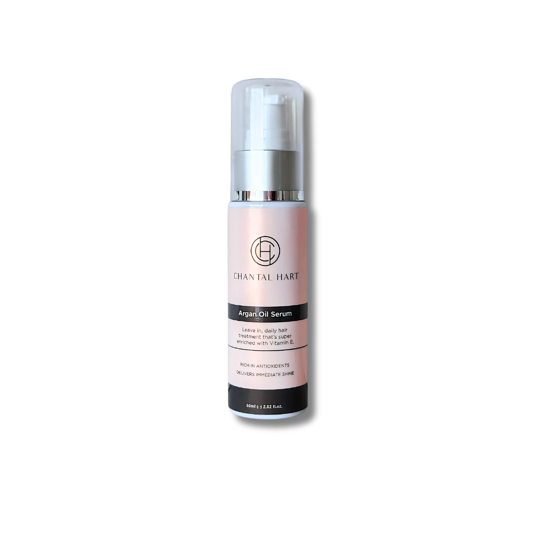 A pump bottle of Chantal Hart Argan Oil Hair Serum with a label and branding visible.