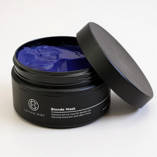 Black jar of Organic 'Blonde Mask' with purple blue contents on a white background