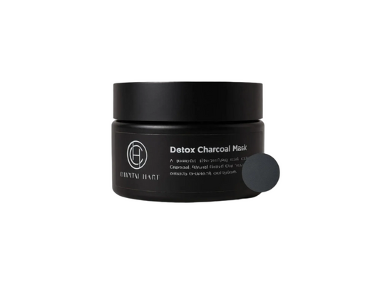 Black detox charcoal mask in jar with brand logo on a white background