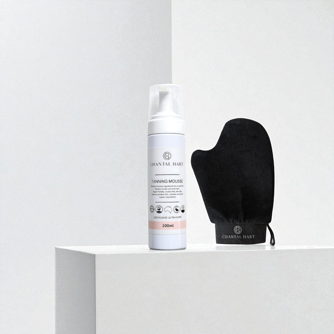 Chantal Hart tanning mousse bottle with black mitt on a white background
