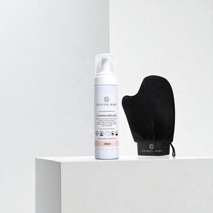 Chantal Hart tanning mousse bottle with black mitt on a white background