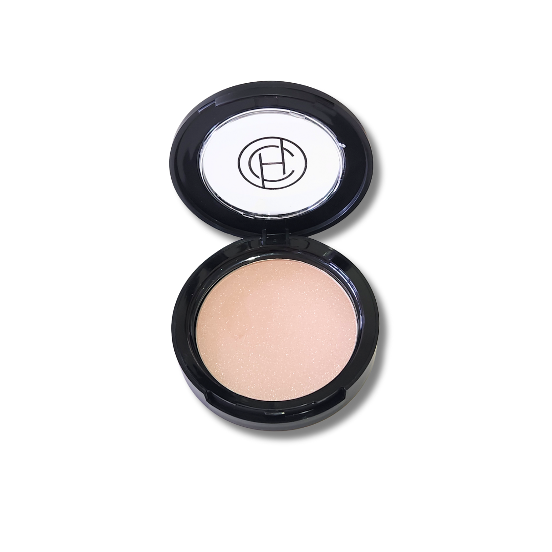 A compact mineral bronzer by Chantal Hart, open with the product visible inside the compact case.