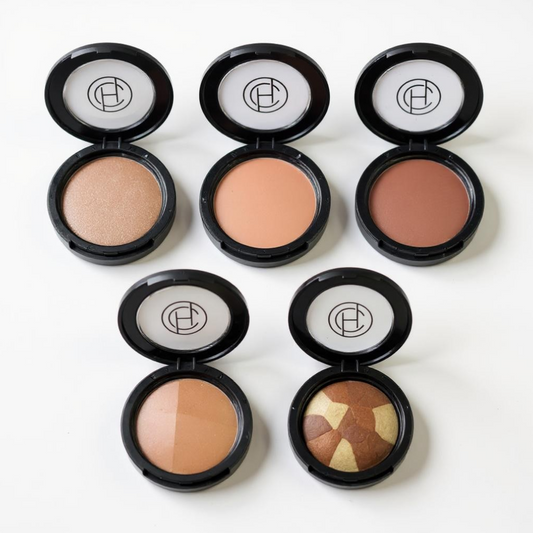 Five different types of mineral makeup bronzers in black compacts designed for warming and bronzing the skin