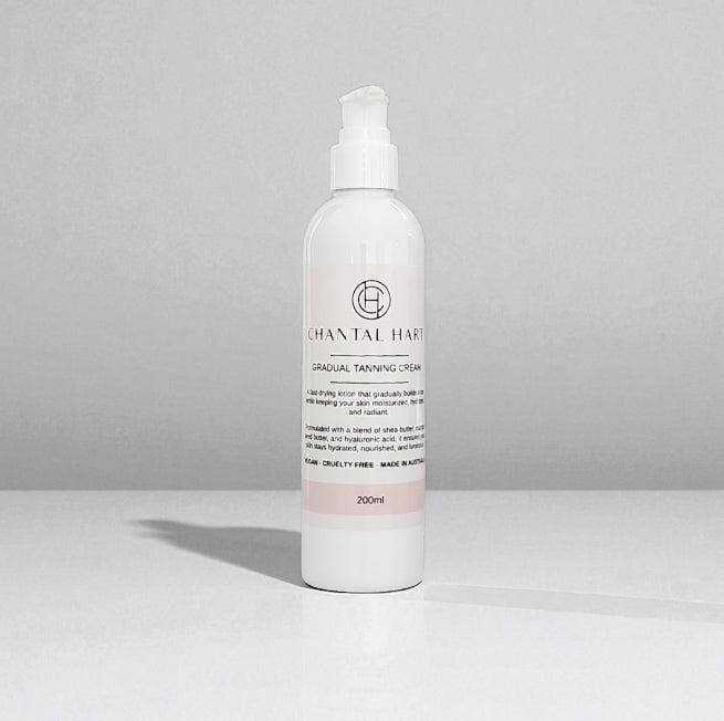 White bottle of Chantal Hare gradual tanning cream on a gray background