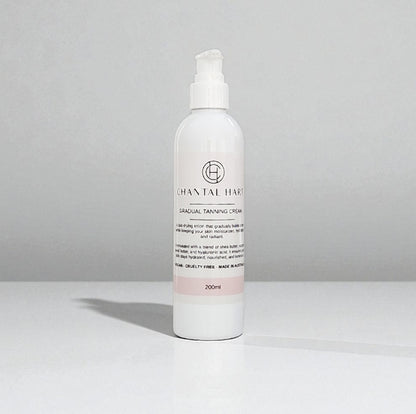 White bottle of Chantal Hare gradual tanning cream on a gray background