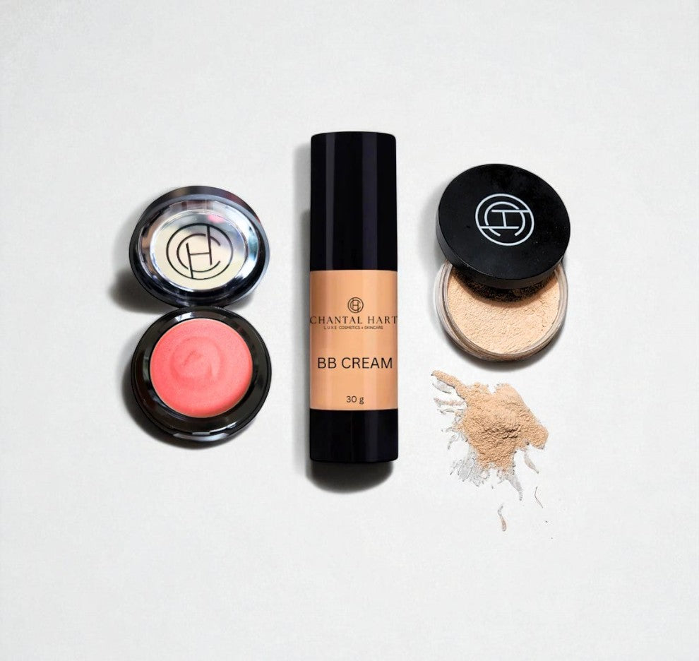 Makeup products including BB cream, blush, and powder on a light background